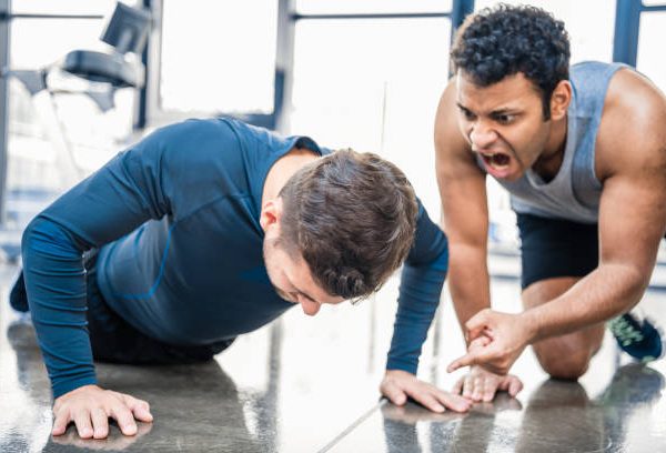 Generic photo of personal trainer yelling at a client.